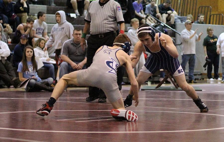 Sophomore AJ Clutter wrestles in the GAC Conference meet