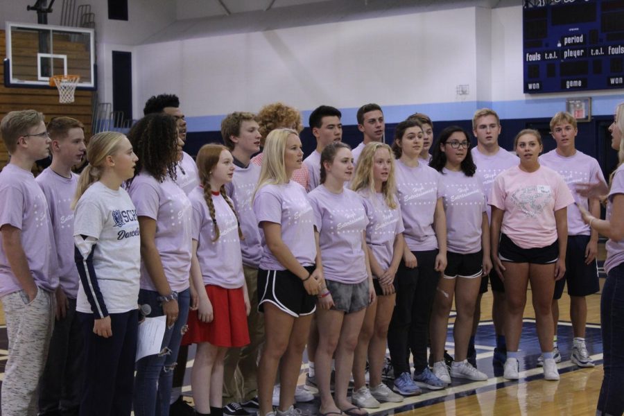SCHS Madrigal Choir sings the National Anthem at the Homecoming Assembly.