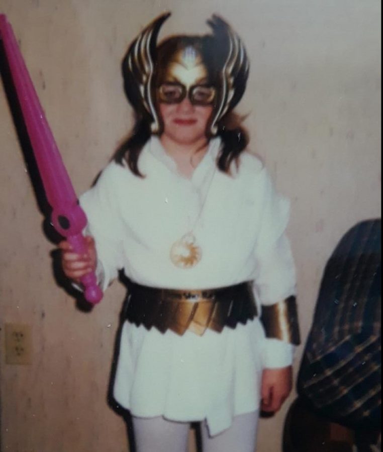 Adviser Lauren Hippe - 6 years old
When I was young, I was obsessed with the cartoons He-Man and She-Ra, so for Halloween 1986, I rocked the She-Ra costume. 
