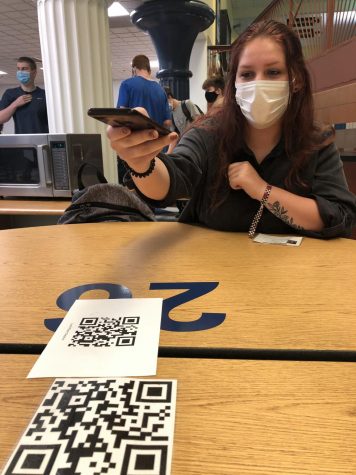 TABLE 26. During the school day of September 10th, Senior Madalynn Turner scans the QR code to sign into lunch. Due to COVID, students sign into lunch to mark where they sit for the day.