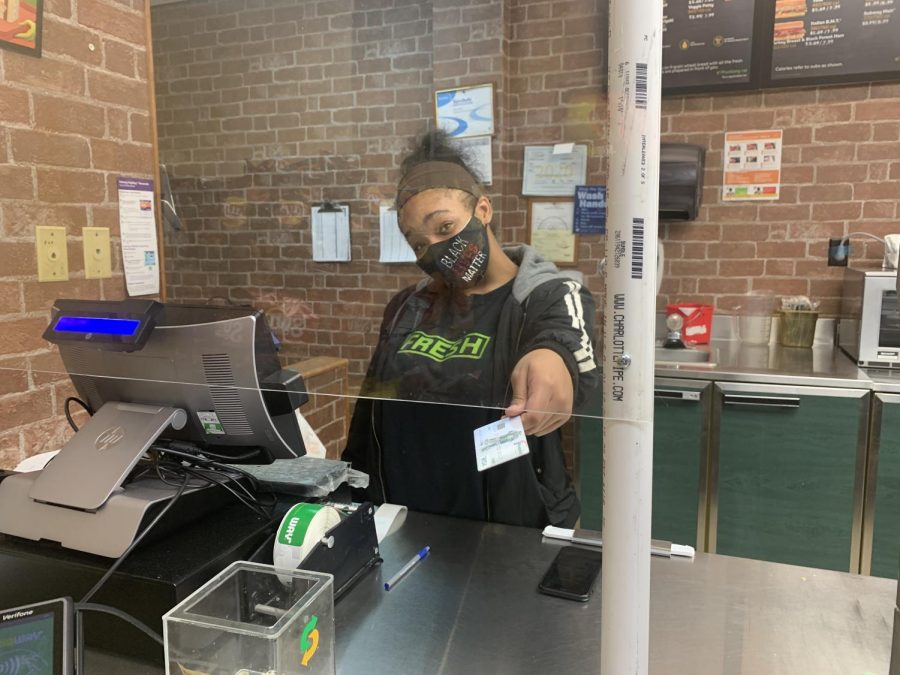 Aniyah Hamel running the register at her job.