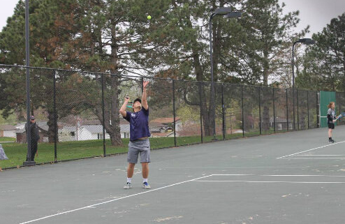 Nick Quay serves the ball. 