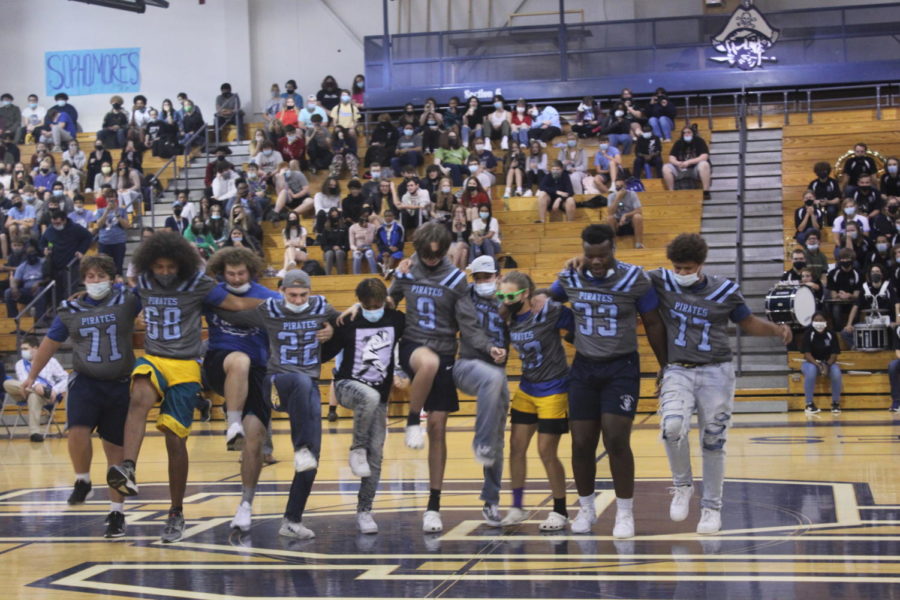 The football team formed a kickline in their dance.