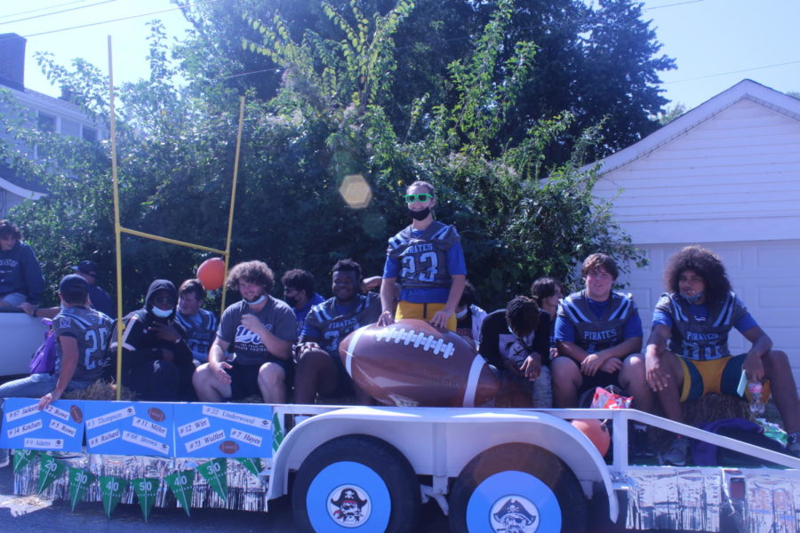 The football team with their well decorated float.