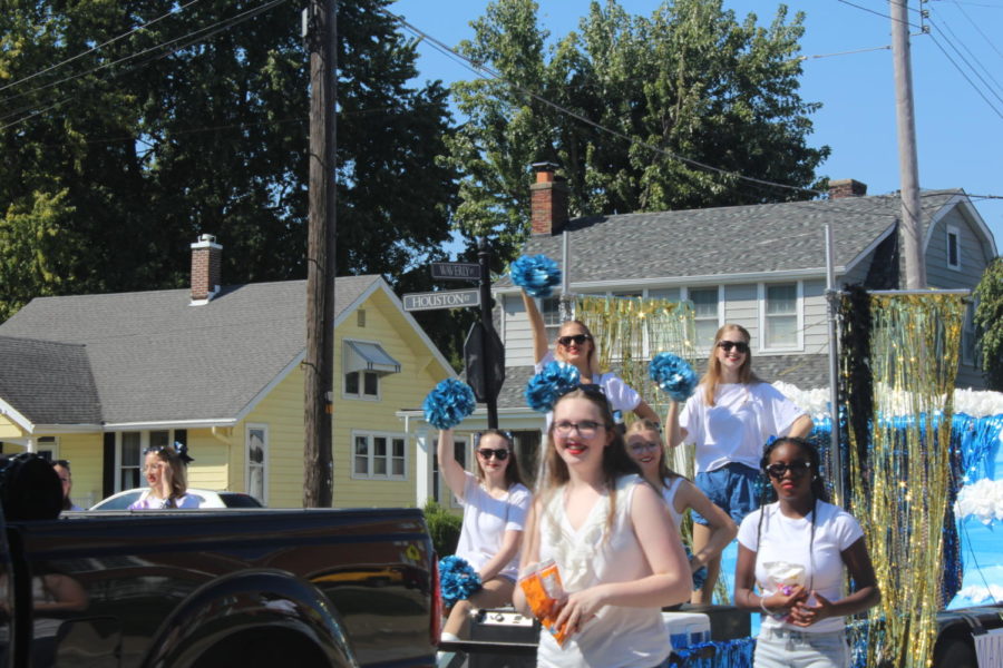 On Oct. 8 Danceline  members throw candy at the parade.