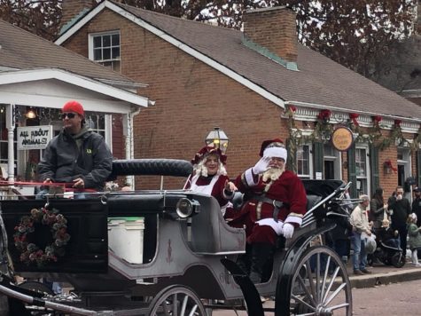 Santa and Mrs. Claus greet guests before going down for pictures with Santa at the depot.