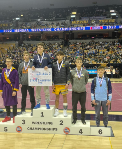 Levi Perry-South stands at sixth on the podium for the 126 pound weight class of class 2 wrestlers in Missouri