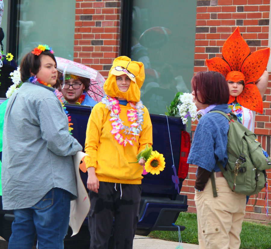 Maddie Kratzer gets ready to walk with her fellow flower friends in the Homecoming parade on Sept. 23.