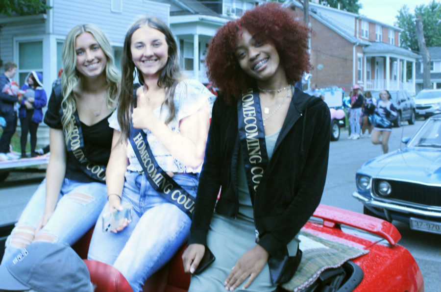 Ashley reed, Hailey Newton, Denia Strickland,  Senior hoco court leading the parade on the back of a convertible Sept. 23. 