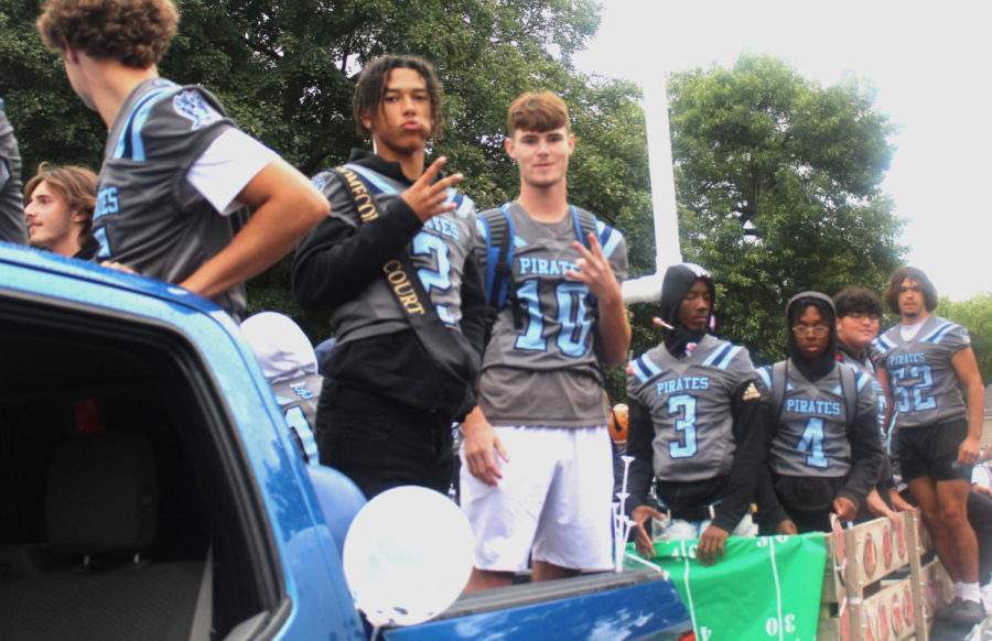 Football players Jordan Rowe and Blake Wiggs pose on their float during the hoco parade on Sept. 23. 