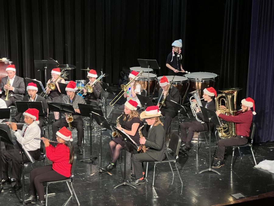 The brass section plays Christmas songs on Dec. 9.