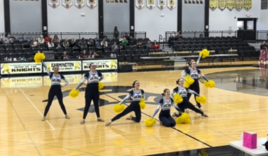 The danceline ends their mix dance with a bang.