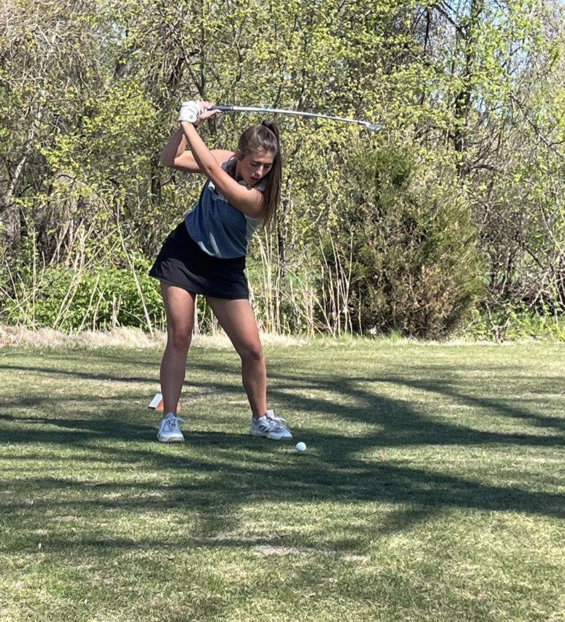Aliana Thomas focusing on hitting that golf ball
