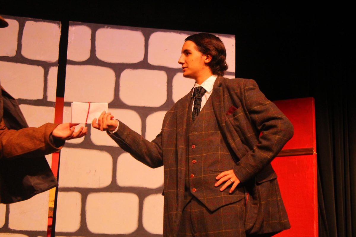 Professor Moriarty(Christian Gustafson. left) and Sherlock Holmes(Chase Schnaible, right) argue about Moriartys villainous plans. 