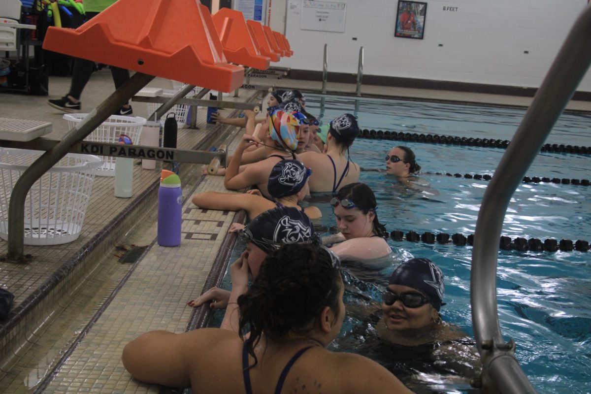 The swim team prepares for another day of hard work at the beginning of their practice 