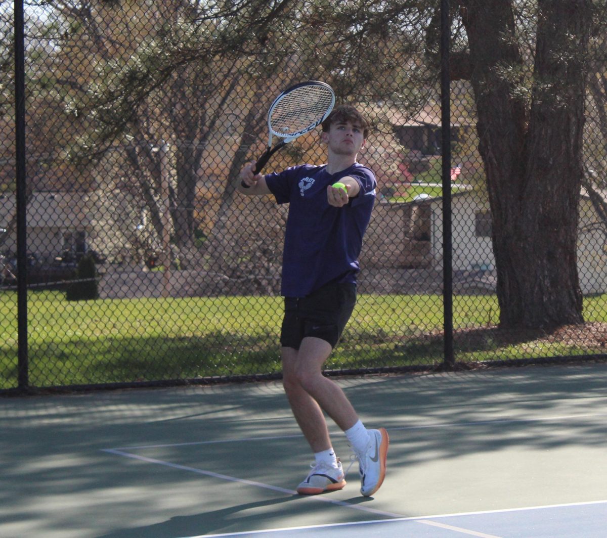 Owen Cross gets ready to serve the ball