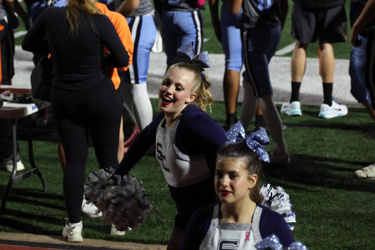 Emerson Luetkenhaus cheering at the Homecoming Football Game