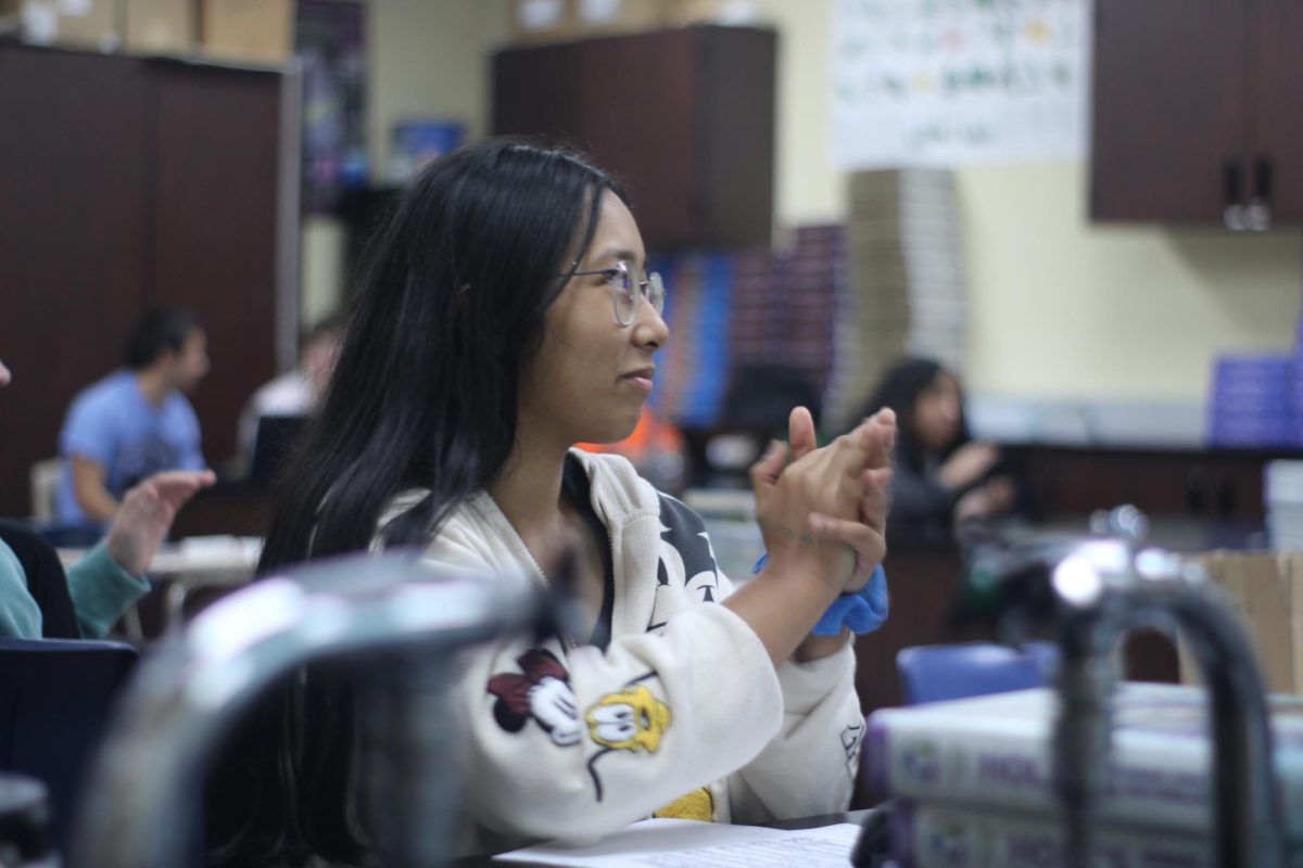 Congratulating her peers, Sabrina Villar claps for their efforts in speaking for their position. On Sept. 24 HOSA voted for their club officers. 