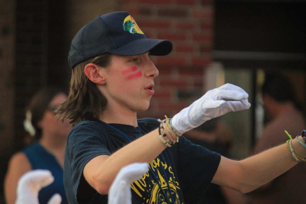 Max Sheils conducts the band.