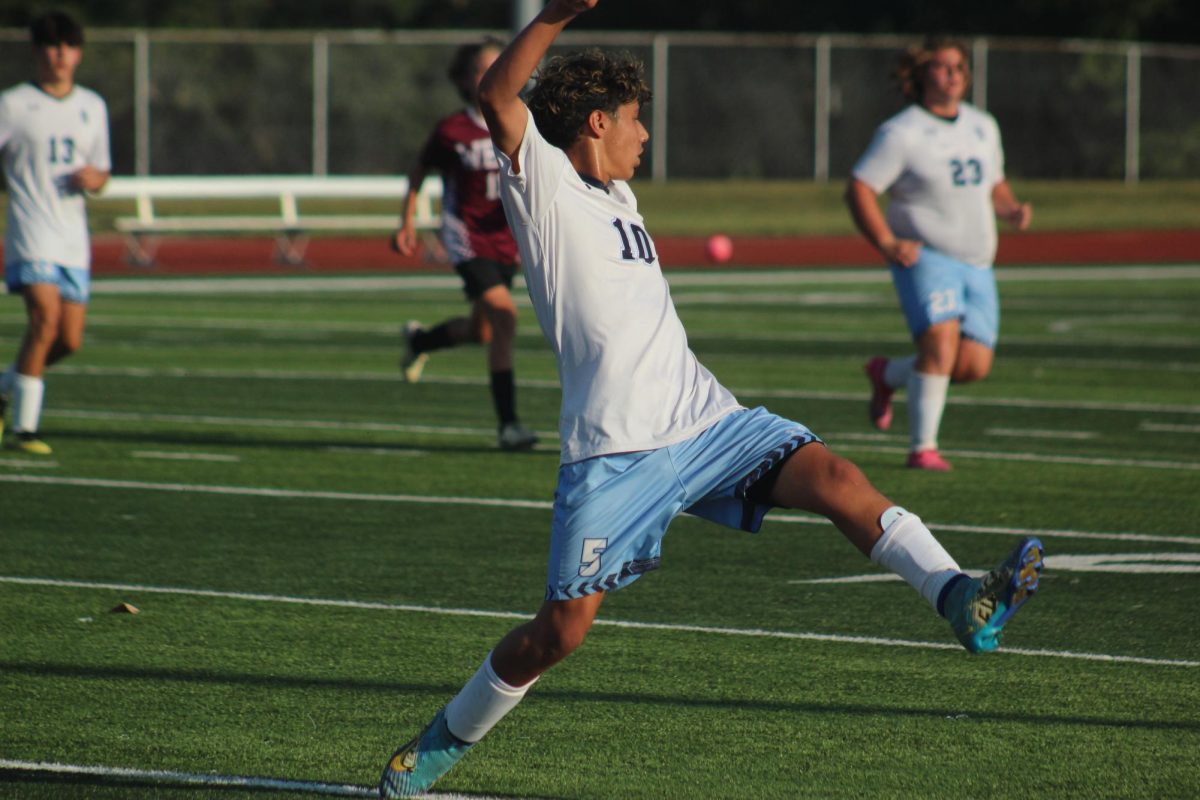 Extending for the soccer ball, freshman Chris Navarro attempts to gain control of the play. SCHS JV in the lead against SCW JV tried to keep the score up.