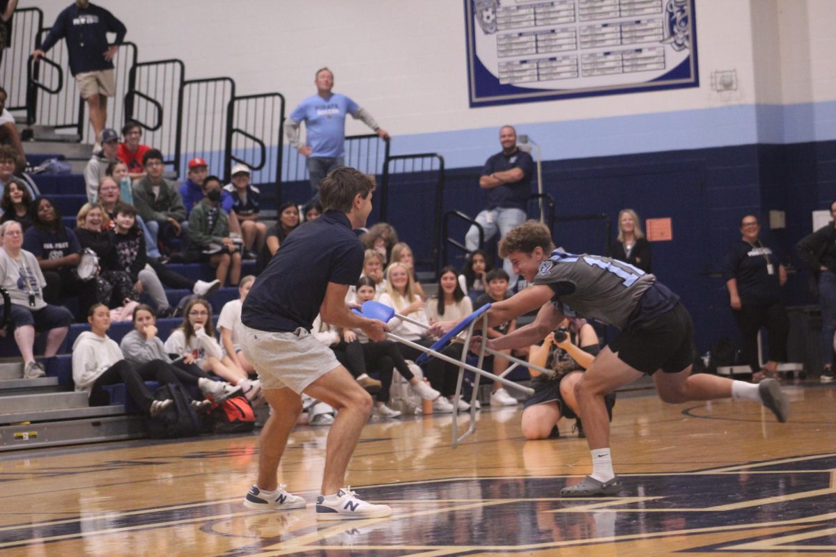 Will Bourgeade and Charlie Reid fighting over the last chair in musical chairs during assembly 