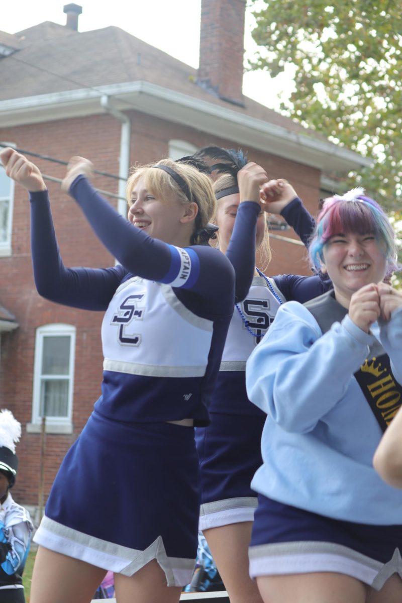 Cheer dancing on their float 