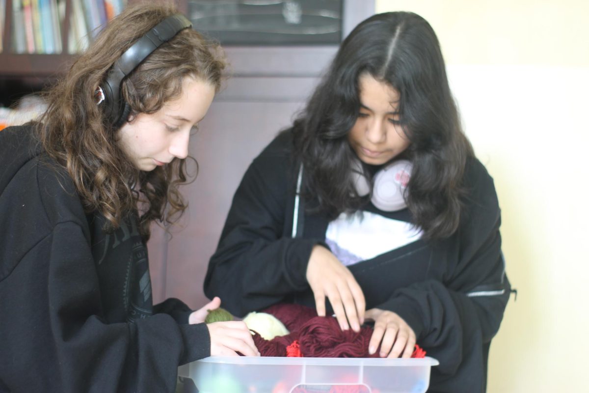 On Sept. 16 students Mia Vazquez and Addy Graf look for the yarn to start their projects. Vazquez taught Graf how to crochet shortly after.
