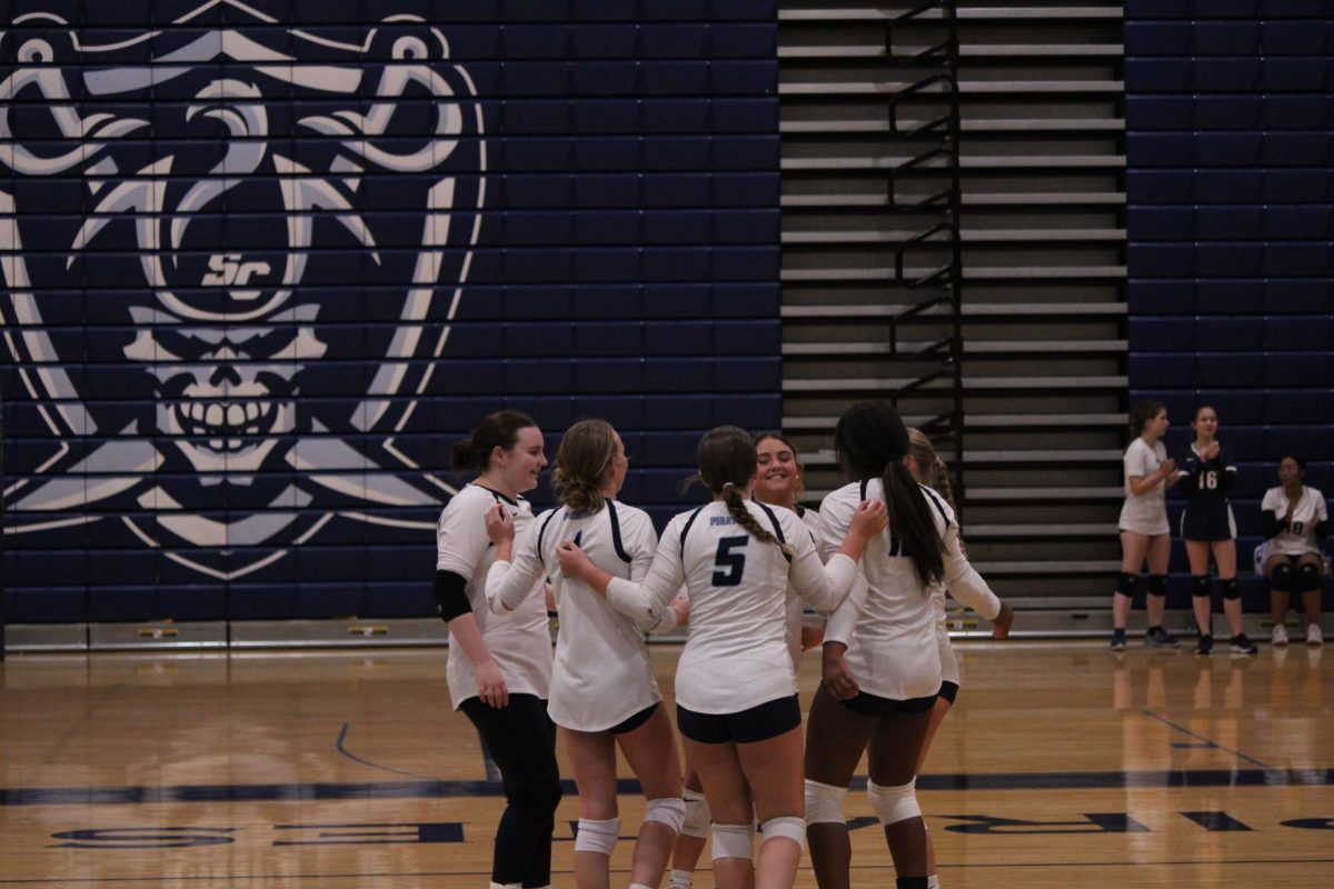 In a JV volleyball game at St. Charles High School against Timberland on Sept. 9, sophomore Jaylie Deutschmann and her other teammates celebrate getting a point. They ended up losing the game.