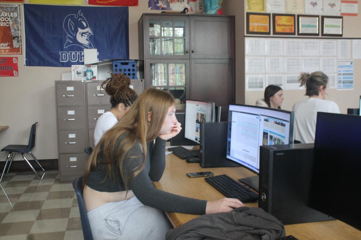 Lana Usery and Violet Lewis work on assignments for their Newspaper class. They were chosen as Co Editors Chief.