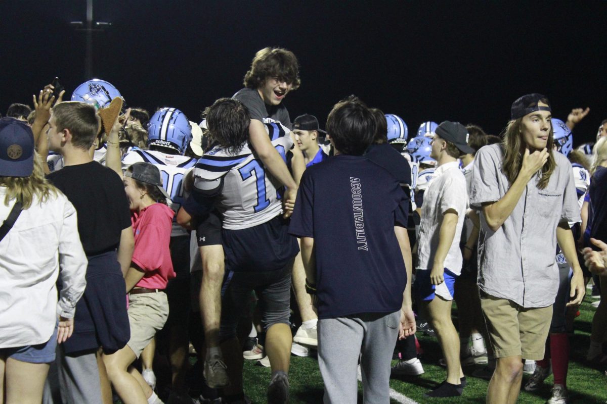 Rylan Kissell celebrating with team and peers after the game 