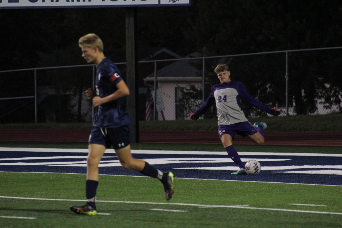 Lucas Skeen kicks the soccer ball 