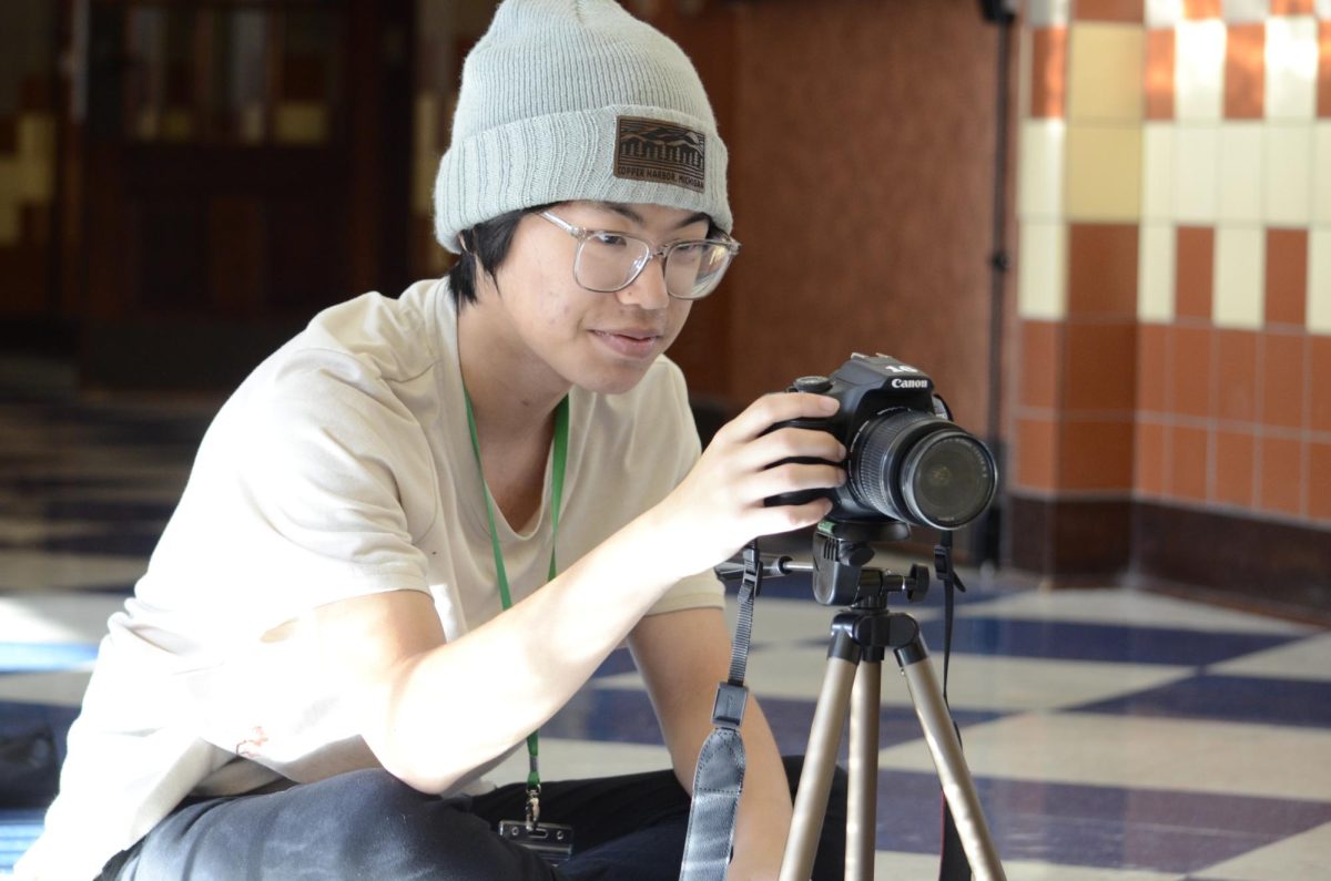 Eaken Vang (10) tries to perfect his camera setting