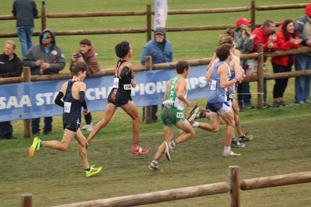 Elijah Case running during the state meet 