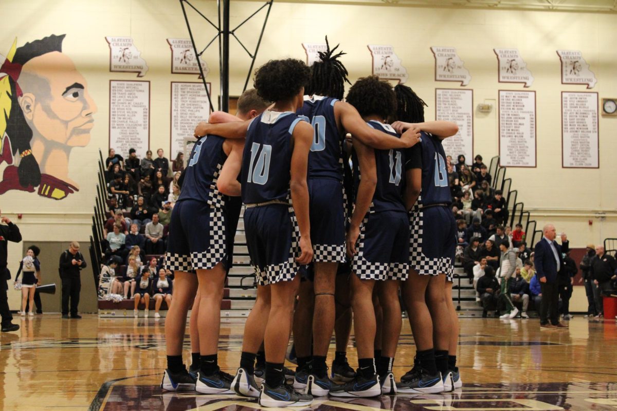 The Pirates getting ready for the game in a huddle