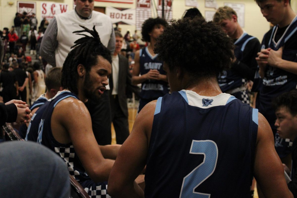 Jadon Salamone and Jordan Rowe on the bench during half time 