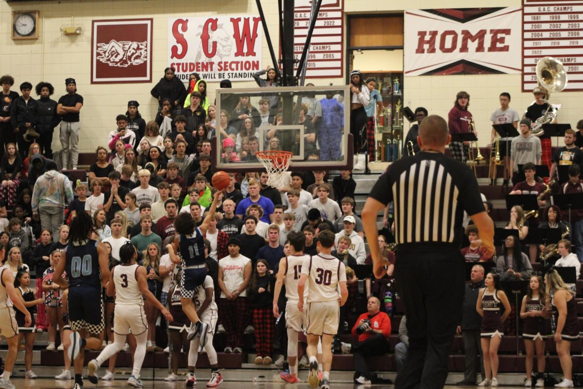 Tanner Dutton reaching for the layup