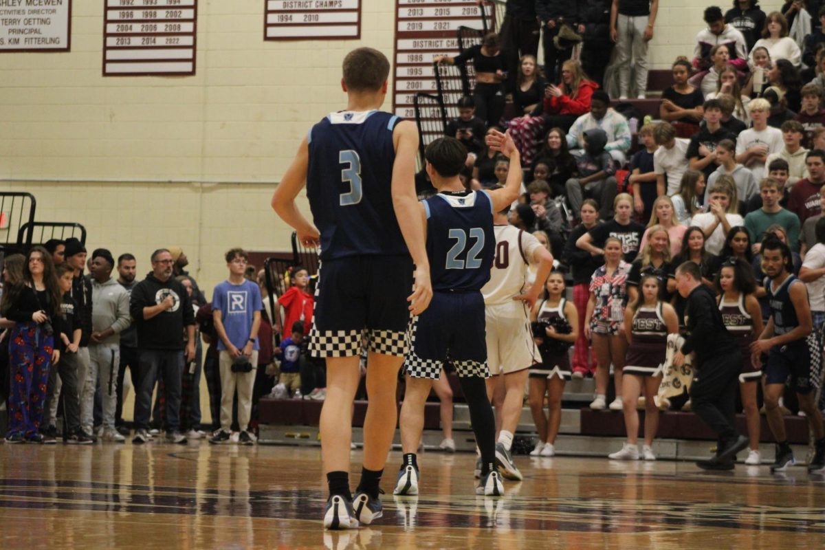 Conner Bayliss (#22) and Chase Pugh (#3) calling their team back for defense 