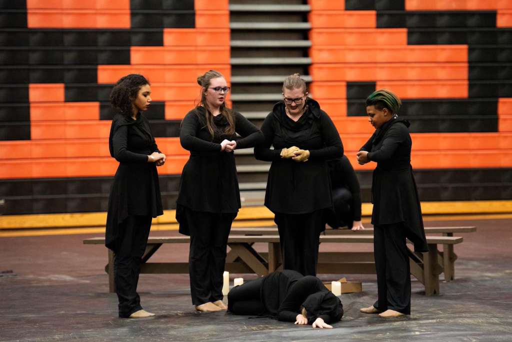 The Winter Guard team performs an ominous depiction of a murder in a photo from the 2023/2024 school year.