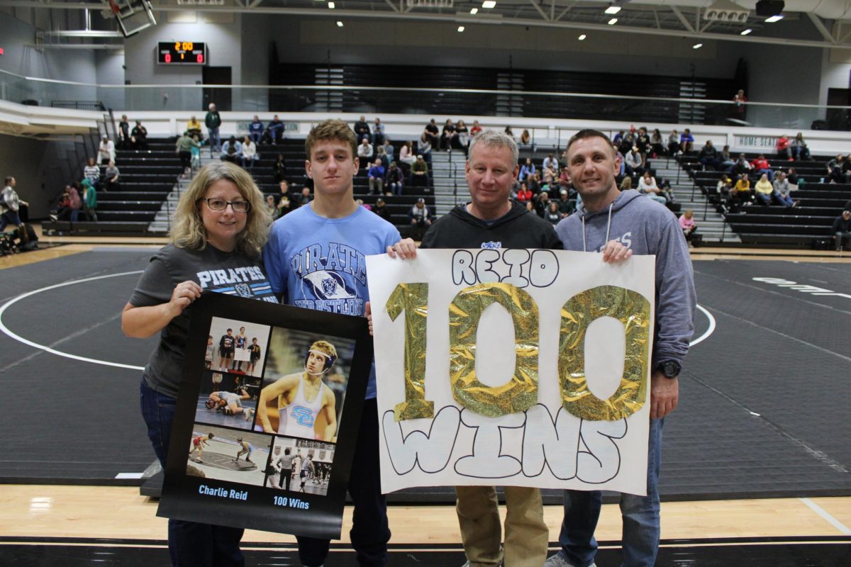 Charlie Reid with Coach and Family after 100th win