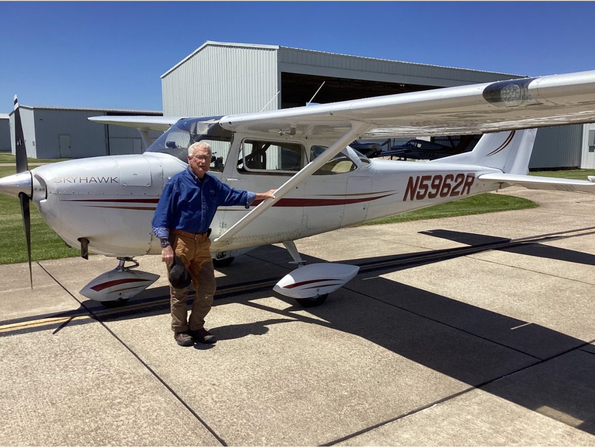 Nick Prinster next to his Cessna-172 owned in partnership