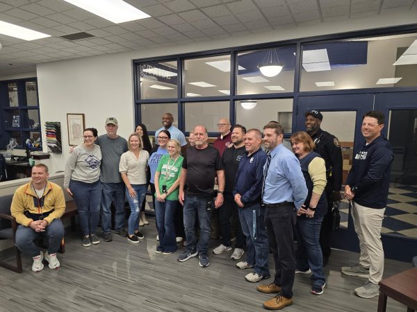 SCHS Staff stands with Tom Wright to take a celebratory photo