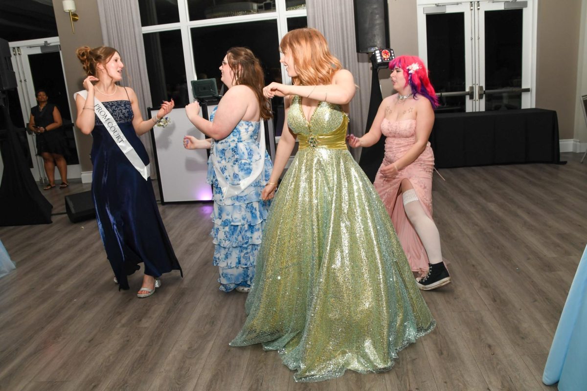 Orion Schaub dancing with friends at prom