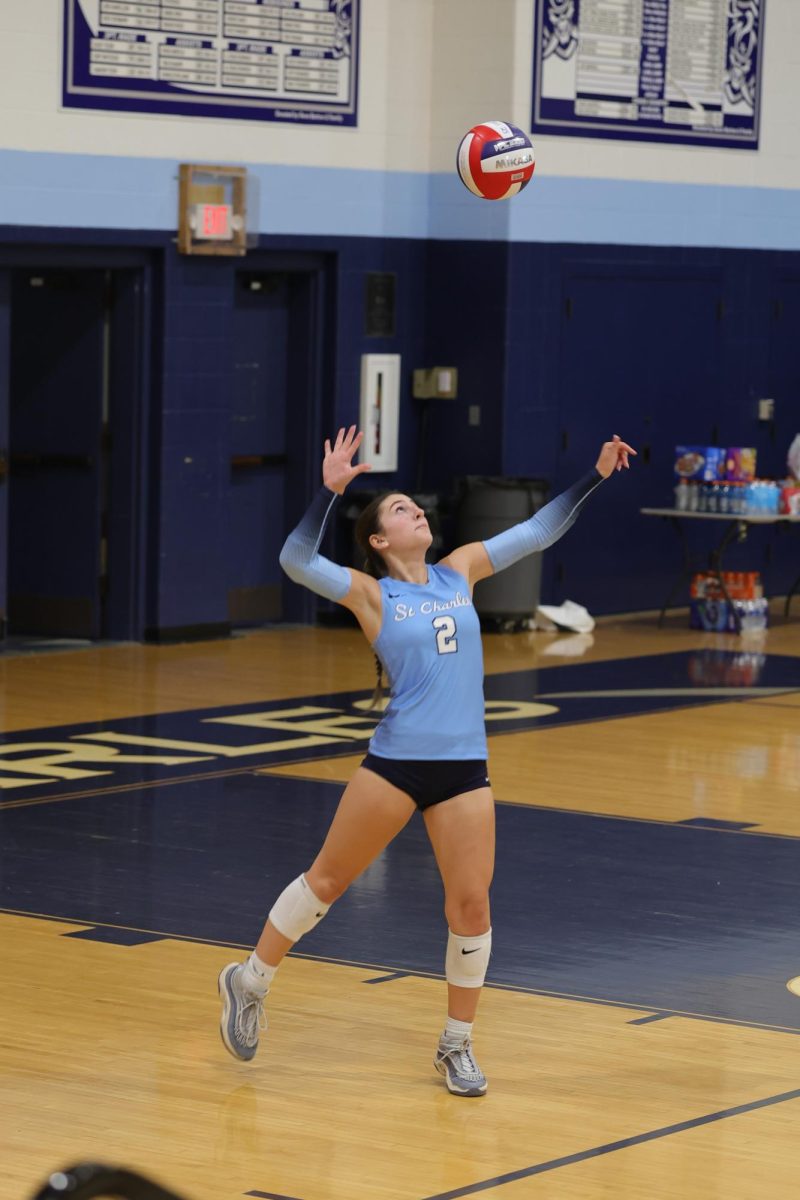 Lilly Bott serving the ball