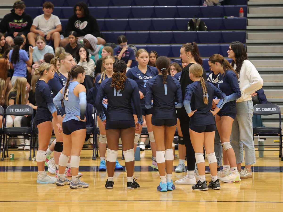 Varsity talking together after the set