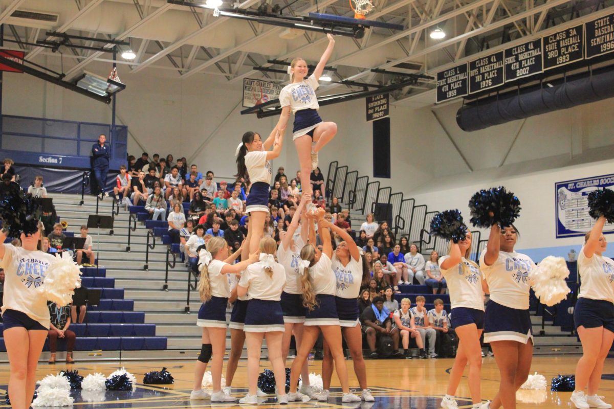 Allison Lindquist and Candice Hill fly in an assisted lib