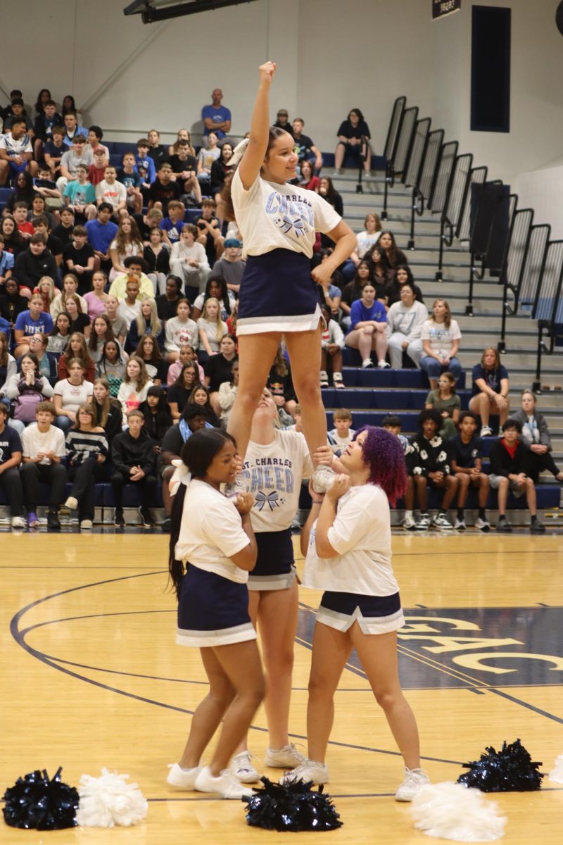 Varsity Cheerleaders do a prep for their performance