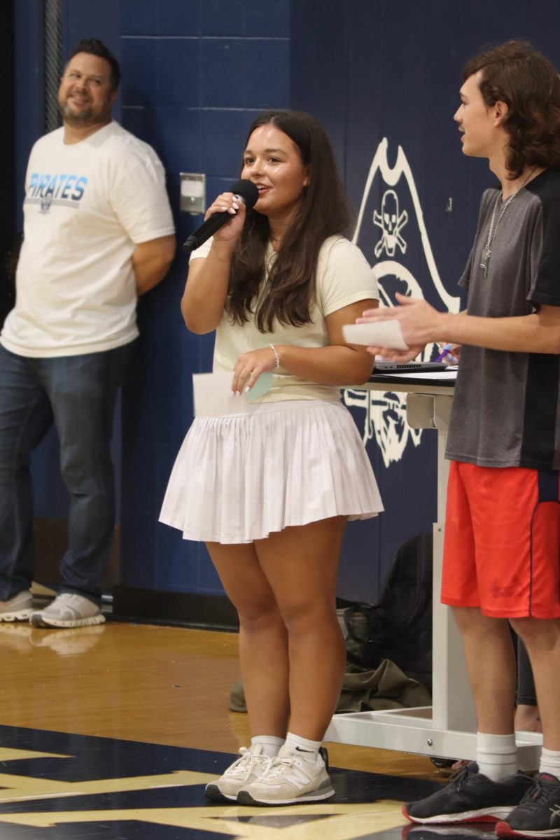 Monica Ferguson leads the assembly with her fellow STUCO leaders