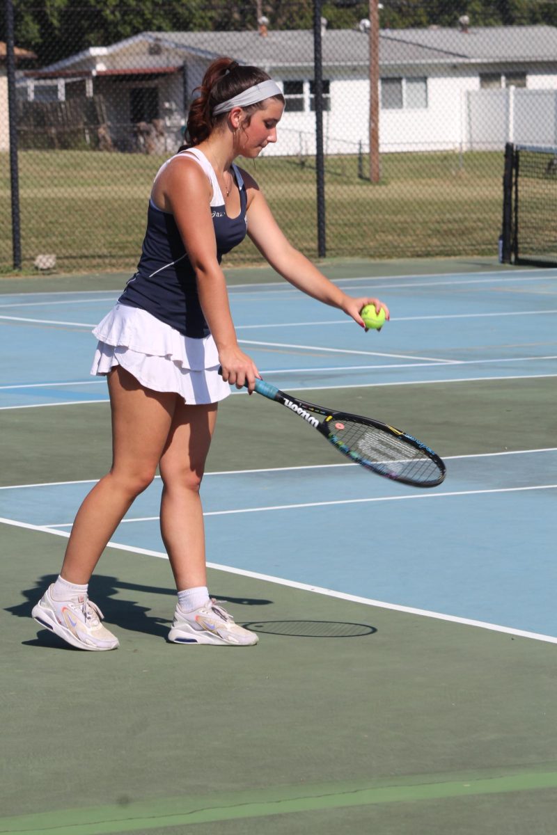 Isabelle Eaton gets ready to serve the ball.