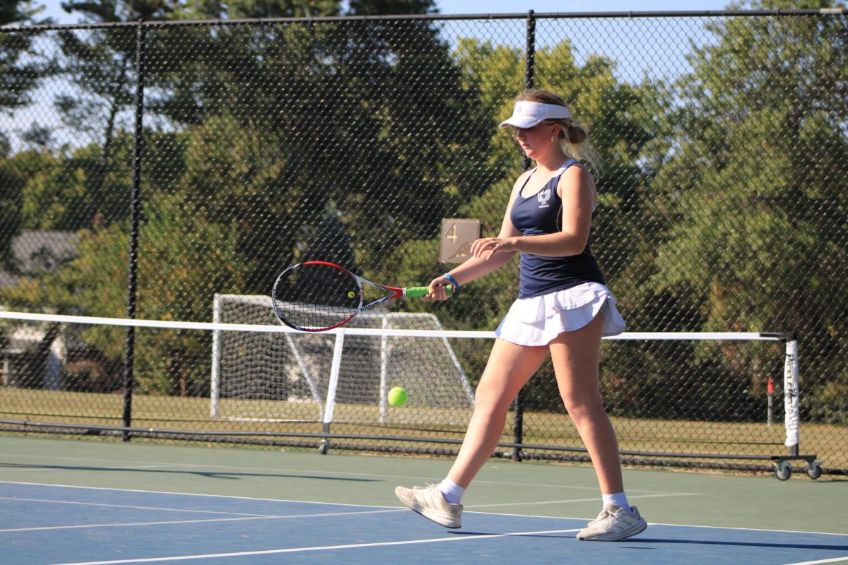 Caitlyn Buchholtz bounces the ball.