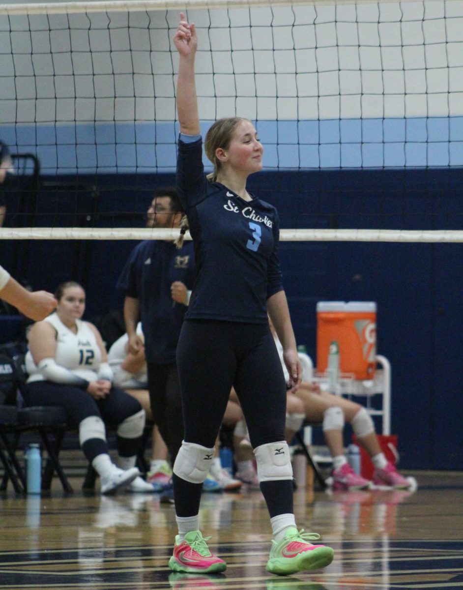 Rosie Kuegele celebrates on the court against Holt on Sept. 4.
